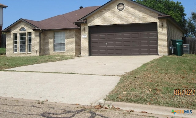 517 Crazy Horse Cir, Harker Heights, TX 76548 - single story home with brick siding, a garage, and concrete driveway
