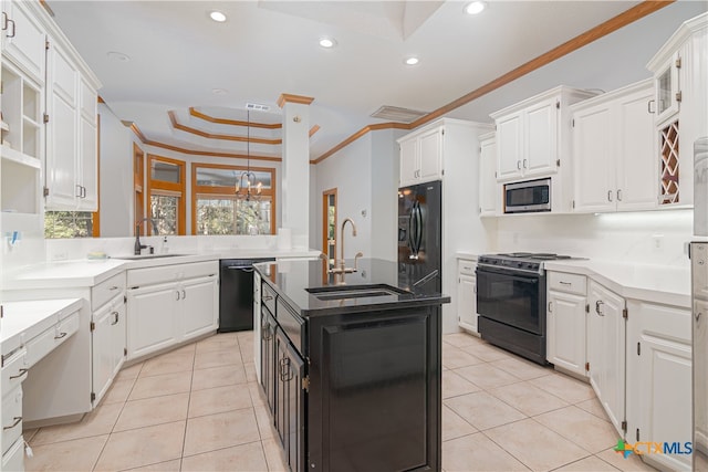 kitchen featuring white cabinetry, sink, black appliances, and crown molding