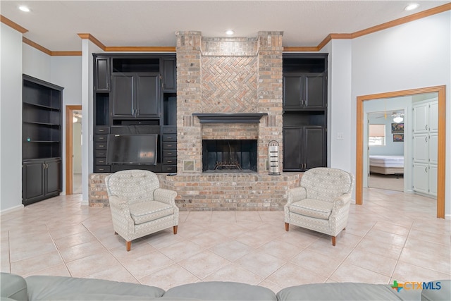 tiled living room with a brick fireplace, ceiling fan, and crown molding