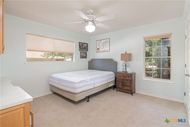 bedroom with ornamental molding, multiple windows, light carpet, and ceiling fan