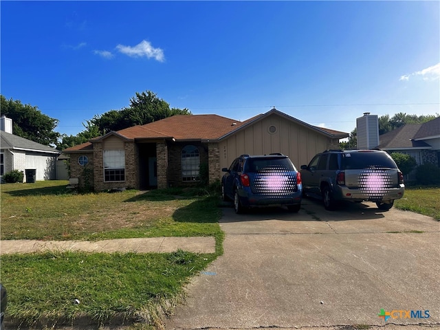 ranch-style house with a front yard