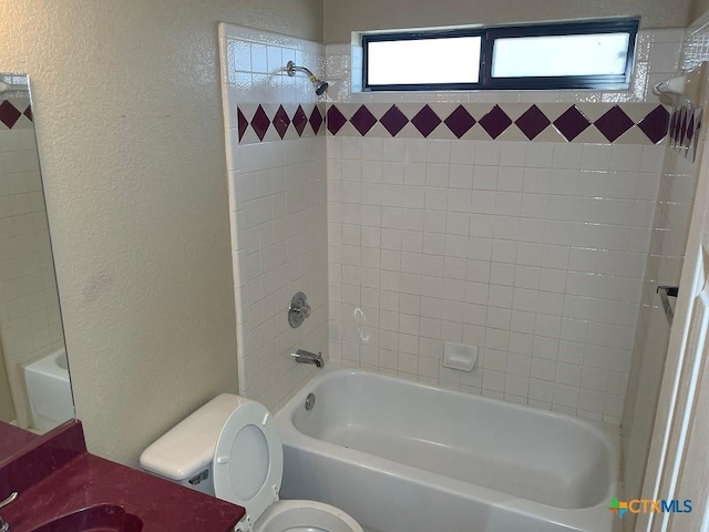 4110 Windwood Dr, Killeen, TX 76542 - bathroom featuring a textured wall, toilet, shower / washtub combination, and vanity