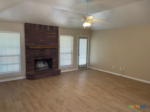 4110 Windwood Dr, Killeen, TX 76542 - unfurnished living room featuring a ceiling fan, wood finished floors, baseboards, and a textured ceiling