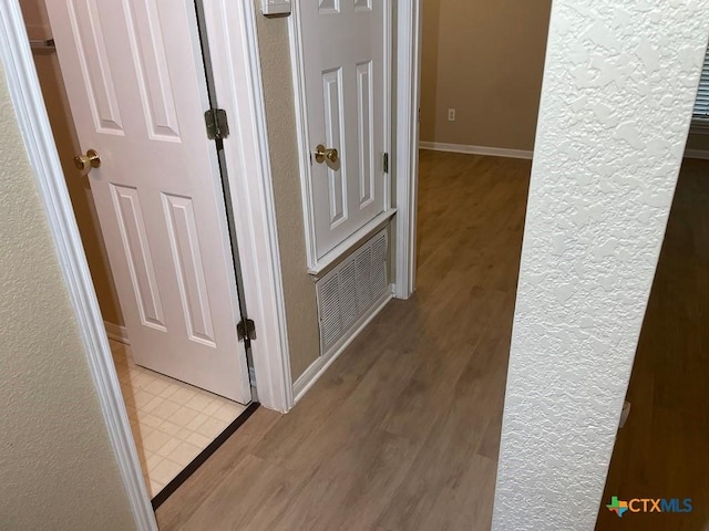 4110 Windwood Dr, Killeen, TX 76542 - corridor featuring wood finished floors and baseboards