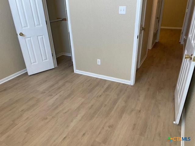 4110 Windwood Dr, Killeen, TX 76542 - unfurnished bedroom featuring light wood-style floors, baseboards, and a closet