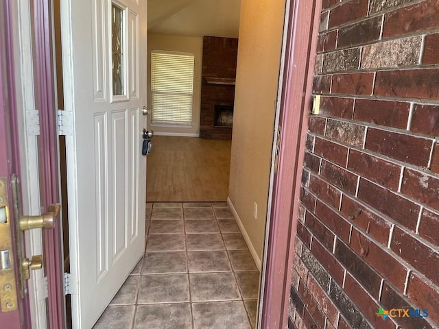 4110 Windwood Dr, Killeen, TX 76542 - hall featuring dark tile patterned floors and baseboards