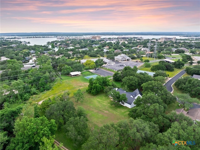 aerial view at dusk with a water view