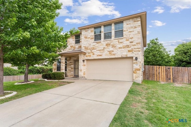 701 Curtis Dr, Killeen, TX 76542 - contemporary home featuring concrete driveway, a front lawn, stone siding, an attached garage, and fence