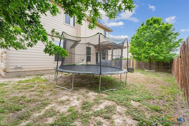 701 Curtis Dr, Killeen, TX 76542 - view of yard with a trampoline and a fenced backyard