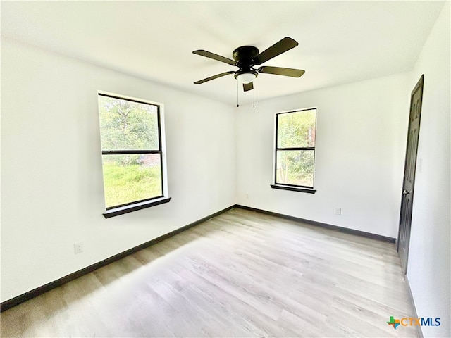 empty room featuring light hardwood / wood-style floors and ceiling fan