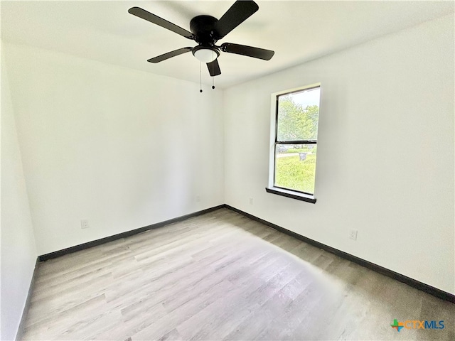 unfurnished room with light wood-type flooring and ceiling fan