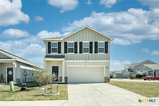 view of front of property with a garage, board and batten siding, and driveway