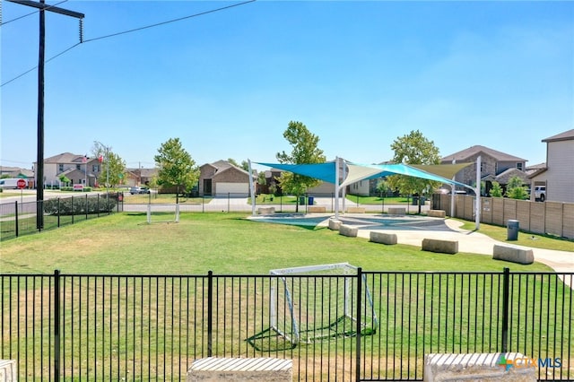 view of yard featuring a residential view and fence