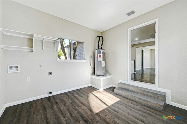 laundry area with hookup for an electric dryer, electric water heater, dark hardwood / wood-style flooring, gas dryer hookup, and hookup for a washing machine