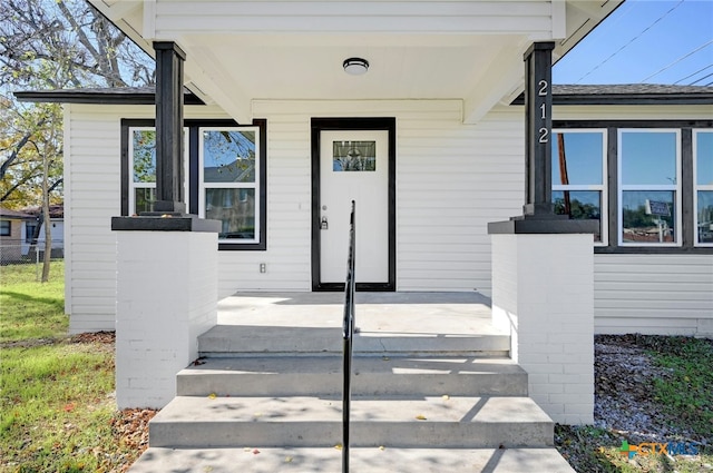 doorway to property with a porch