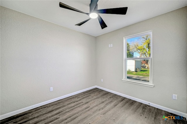 spare room featuring ceiling fan and wood-type flooring