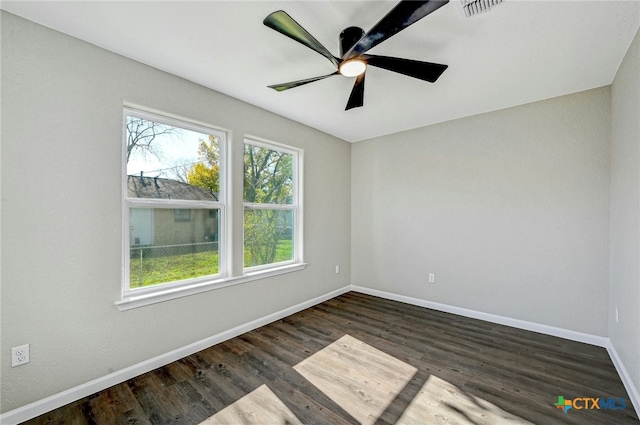 empty room featuring dark hardwood / wood-style floors and ceiling fan