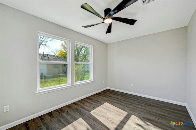 212 S Walnut Ave, Luling, TX 78648 - unfurnished room with ceiling fan and dark wood-style flooring
