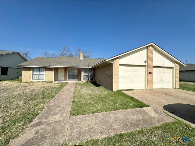 single story home with a garage and a front yard