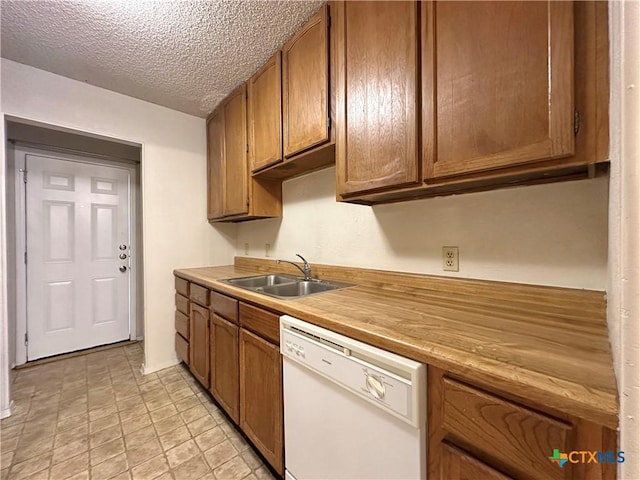 kitchen with sink, a textured ceiling, and white dishwasher