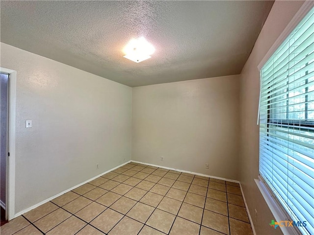 empty room with a textured ceiling