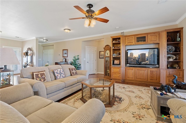 living room featuring crown molding, light hardwood / wood-style flooring, and ceiling fan