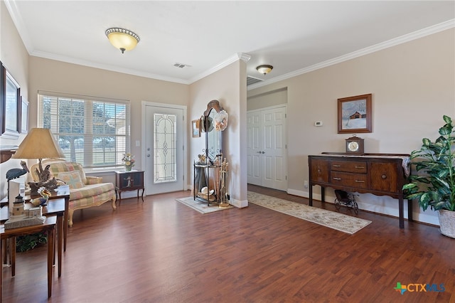 sitting room featuring crown molding and dark wood-type flooring