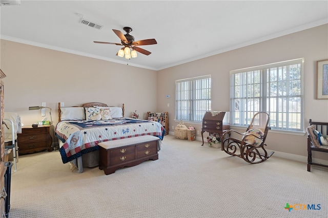 bedroom featuring light carpet, ceiling fan, and ornamental molding