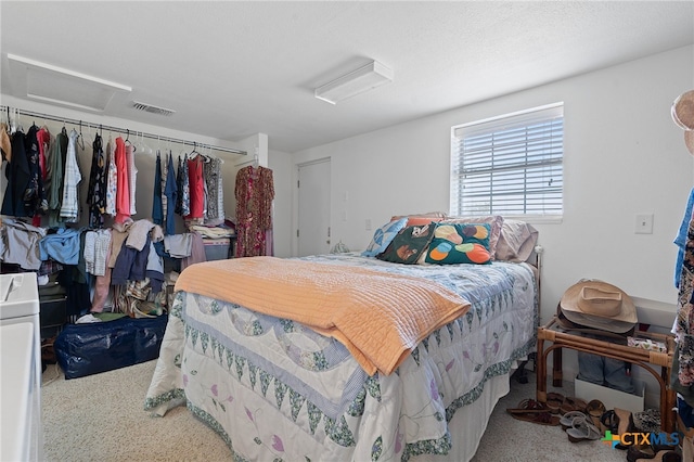 bedroom featuring carpet flooring and a closet