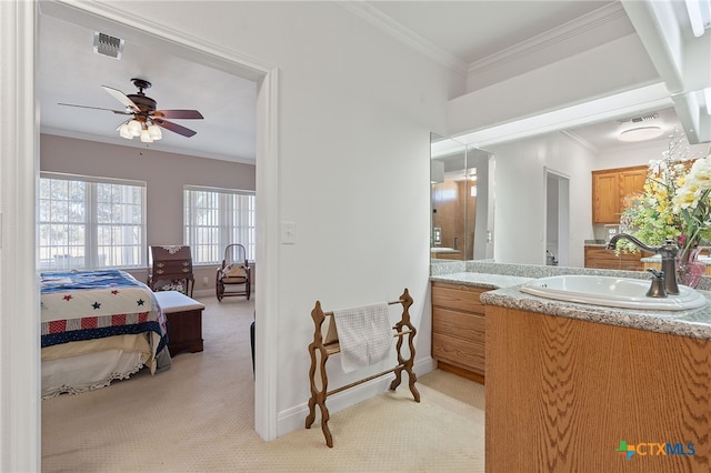 bathroom with vanity, crown molding, and ceiling fan