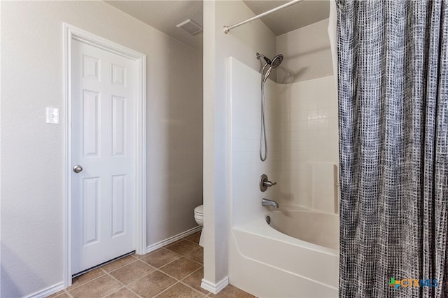 bathroom with toilet, shower / tub combo, a textured ceiling, and tile patterned flooring