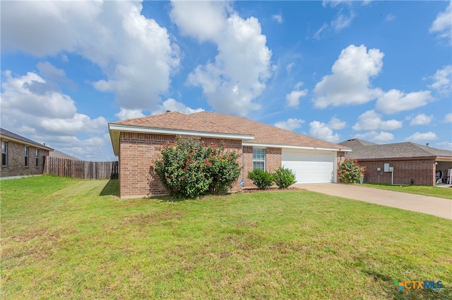 single story home with a garage and a front lawn