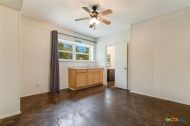123 E Sierra Cir, San Marcos, TX 78666 - empty room with finished concrete flooring and ceiling fan
