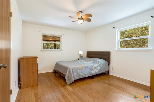 123 E Sierra Cir, San Marcos, TX 78666 - bedroom featuring multiple windows, wood finished floors, and ceiling fan