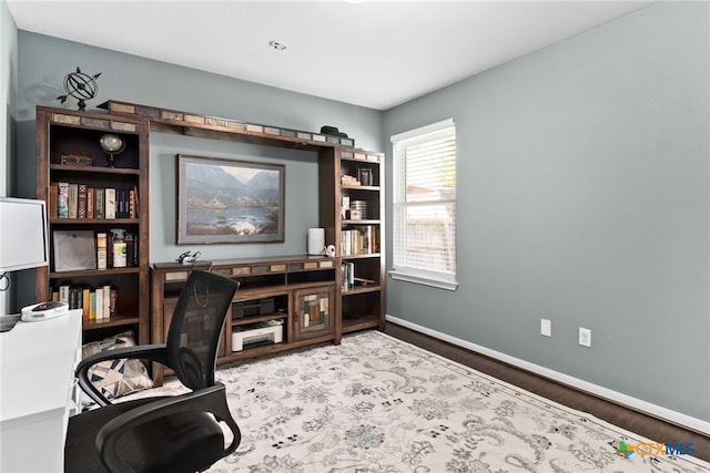 office with wood-type flooring