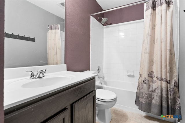 full bathroom featuring tile patterned flooring, vanity, shower / tub combo with curtain, and toilet