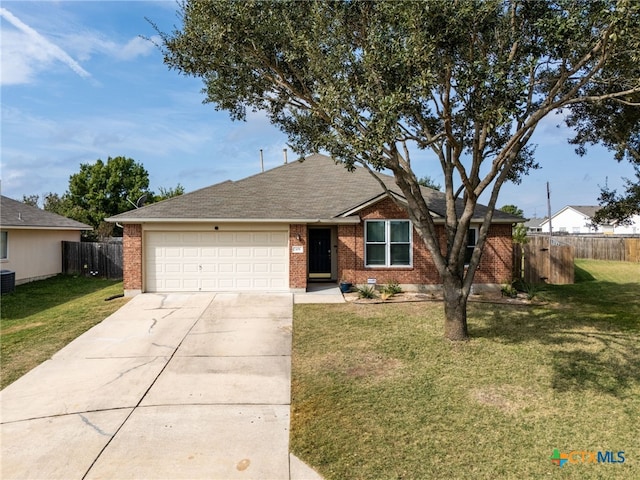 single story home featuring a front yard and a garage