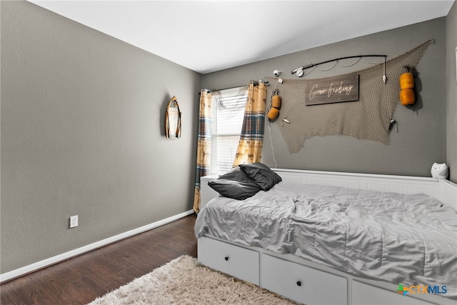 bedroom featuring dark wood-type flooring