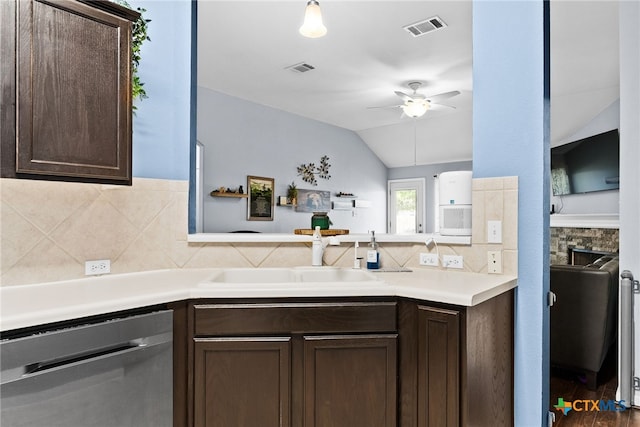 kitchen with dishwasher, lofted ceiling, sink, ceiling fan, and dark brown cabinets