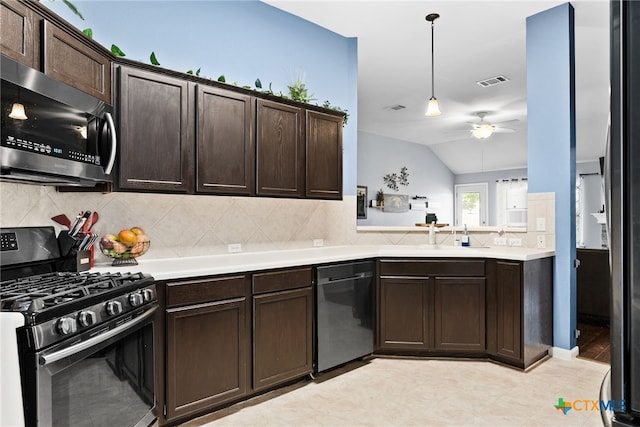 kitchen with dark brown cabinets, hanging light fixtures, appliances with stainless steel finishes, and vaulted ceiling