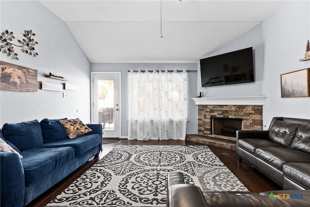 living room featuring a fireplace, dark hardwood / wood-style floors, and lofted ceiling