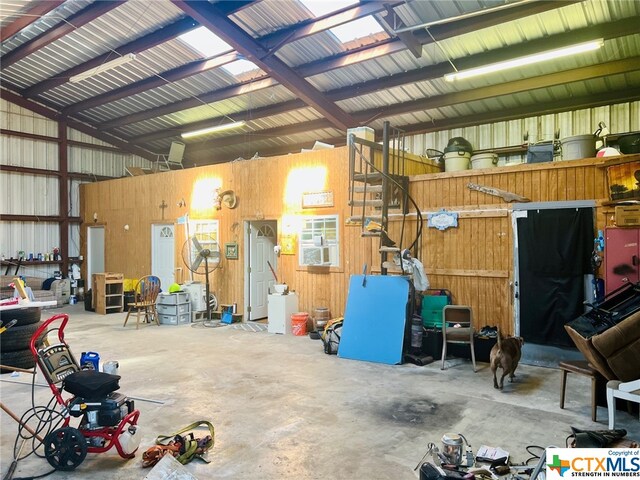 garage featuring wooden walls