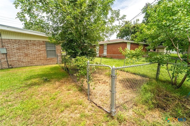 3001 Hummingbird St, Victoria, TX 77901 - view of yard with a gate