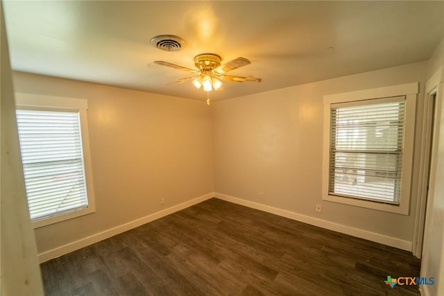 3001 Hummingbird St, Victoria, TX 77901 - empty room with a ceiling fan, plenty of natural light, and dark wood-style flooring