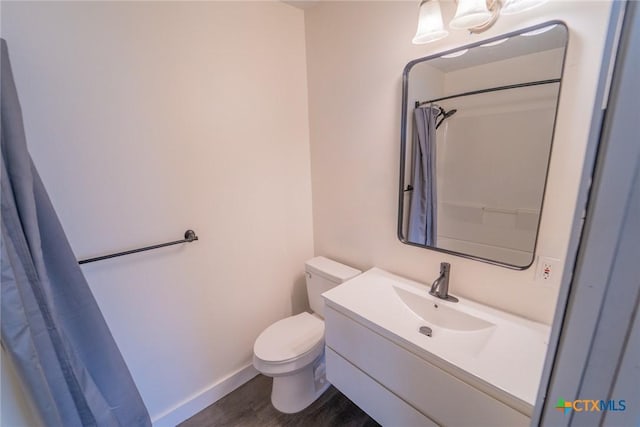 3001 Hummingbird St, Victoria, TX 77901 - bathroom featuring wood finished floors, vanity, and curtained shower