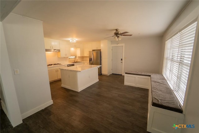 3001 Hummingbird St, Victoria, TX 77901 - kitchen featuring healthy amount of natural light, stainless steel refrigerator with ice dispenser, white gas stovetop, and white cabinetry