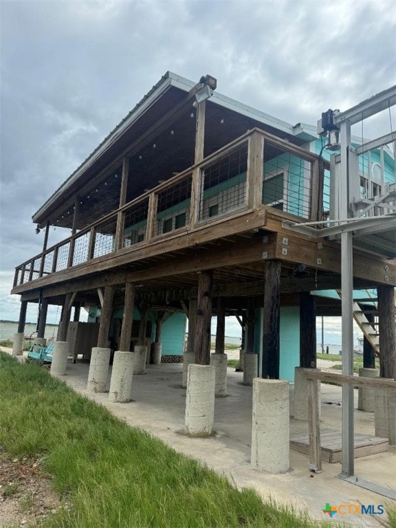 view of community featuring a water view and a patio