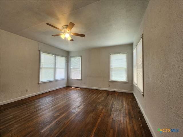 4305 Willow St, Corpus Christi, TX 78411 - spare room with dark wood-style floors, a textured wall, plenty of natural light, ceiling fan, and a textured ceiling