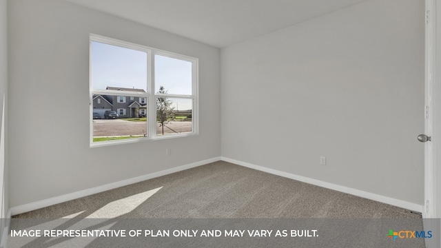 carpeted spare room featuring plenty of natural light