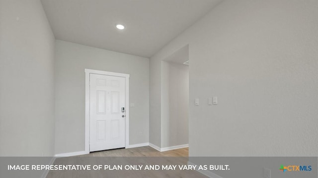 620 Radley Rd, Lockhart, TX 78644 - entryway with wood finished floors, baseboards, and recessed lighting